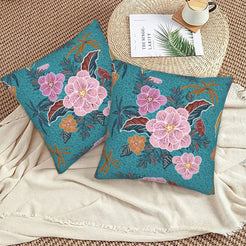 Bohemian floral velvet pillow covers with teal pink flowers, styled on a woven chair