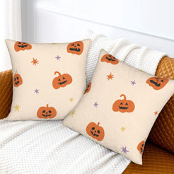Halloween pillow covers with cream orange jack-o-lanterns, styled on a sofa