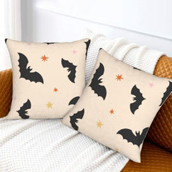 Halloween pillow covers with cream black bats, styled on a sofa