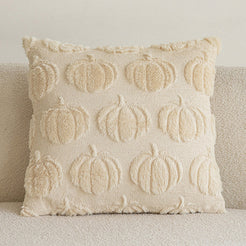 quilted polyester pillow cover with raised cream pumpkin rows, shown on a cream sofa