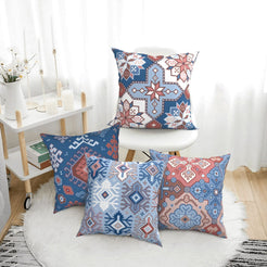 Bohemian short-pile plush pillow covers with blue and rose Aztec motifs, styled on a floor cushion