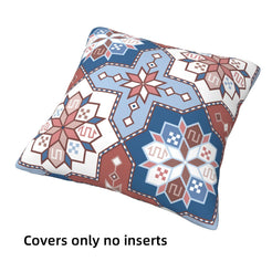 Short-pile plush pillow cover with blue and rose Aztec motifs, shown without an insert