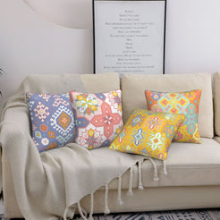 Bohemian short-pile plush pillow covers with pastel multicolor Aztec motifs, styled on a bed