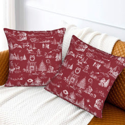 White on burgundy classic Christmas town toile velvet pillow covers styled on a bed
