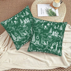 White on green winter holiday toile velvet pillow covers styled on a floor cushion