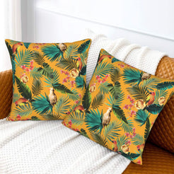 Tropical velvet pillow covers with mustard palms and birds, styled on a sofa