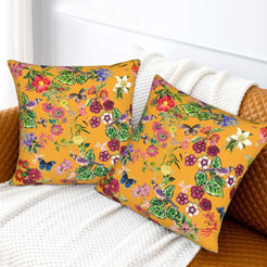 Tropical velvet pillow covers with mustard butterflies and flowers, styled on a sofa