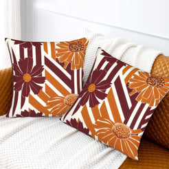 Fall velvet pillow covers with burgundy stripes and orange daisies, styled on a white sofa