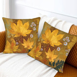 Velvet pillow covers with scattered autumn maple leaves, styled on a white sofa