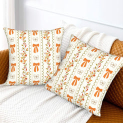 Fall velvet pillow covers with bows, flowers and vertical stripes, styled on a white sofa