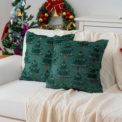 Quilted polyester pillow covers with raised green trees on dark green, styled on a cream sofa
