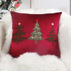 Red velvet pillow cover with embroidered Christmas trees in winter decor