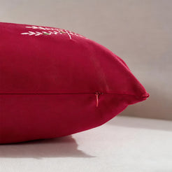 Hidden zipper and piped edge detail on a red velvet lumbar pillow cover