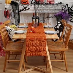 Orange textured pumpkin table runner on a six-seat dining table