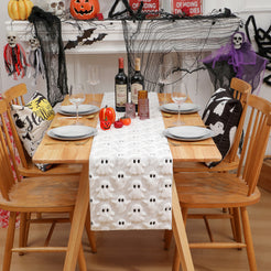 White raised-ghost table runner in a Halloween dining room setting