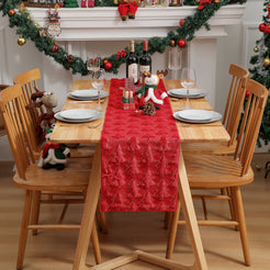 Red Christmas tree table runner on a holiday dining table