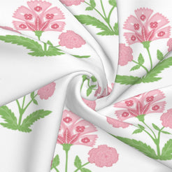 Fabric close-up of long lumbar pillow cover with pink block-print-inspired floral sprigs