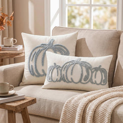 Tufted polyester pillow covers with pale blue outline pumpkins, styled on a cream sofa