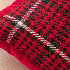 Hidden zipper and fabric close-up on woven polyester pillow cover with red and black houndstooth plaid