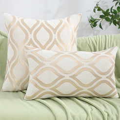 Chenille jacquard polyester pillow covers with cream interlocking lattice, shown in square and lumbar sizes on a sofa