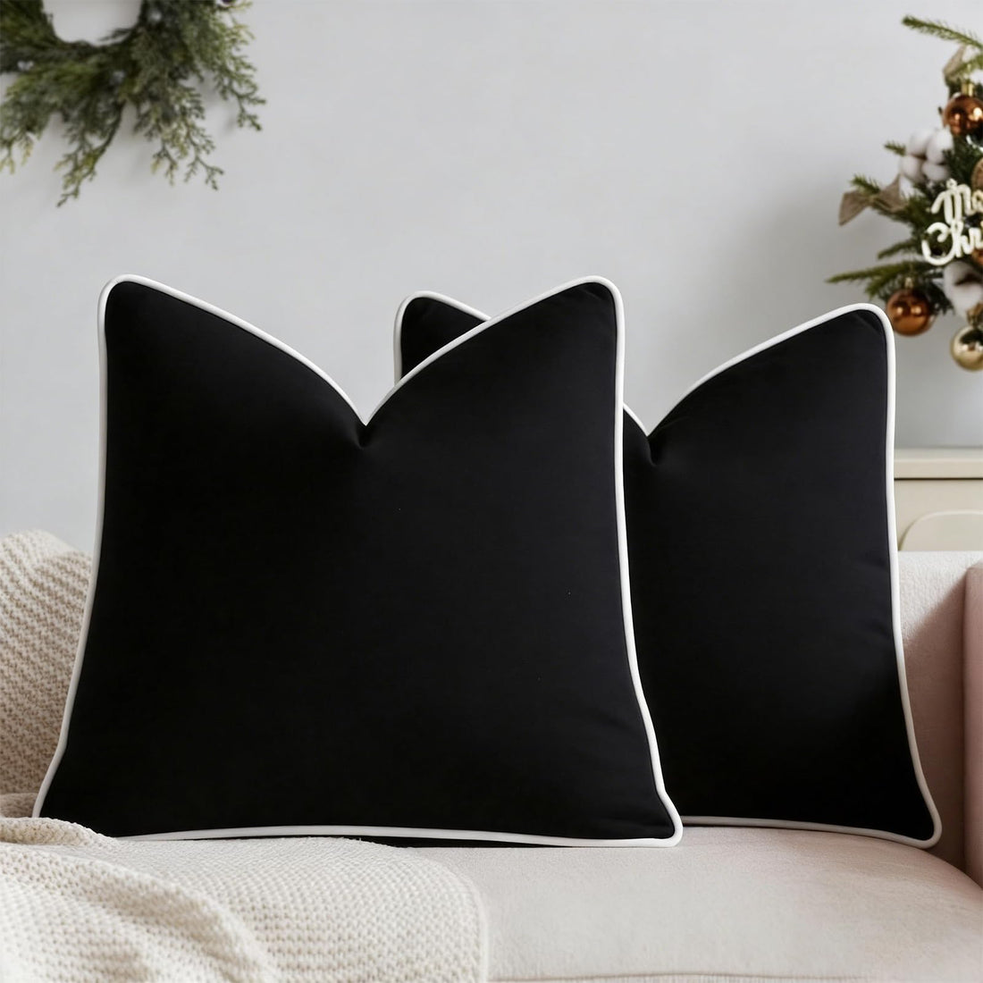 Set of two black velvet pillow covers with contrasting white piping