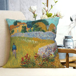 short-pile plush polyester pillow cover with flowering country field and farmhouse, shown on a cream sofa