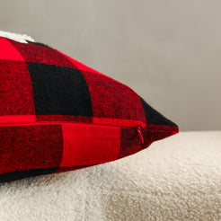 Reverse panel and zipper detail on embroidered polyester canvas pillow cover with red buffalo plaid reverse and hidden zipper