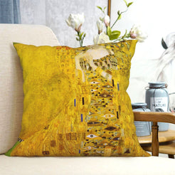 velvet polyester pillow cover with gold portrait with ornate robe and floral details, shown on a cream sofa