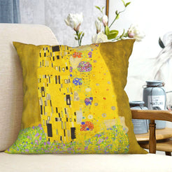velvet polyester pillow cover with gold mosaic pattern with small colorful flowers, shown on a cream sofa