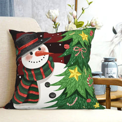 short-pile plush polyester pillow cover with snowman beside a decorated Christmas tree, shown on a cream sofa