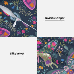 Folk butterfly velvet pillow covers with navy symmetrical butterflies and flowers, styled on a woven chair