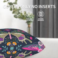 Folk butterfly velvet pillow covers with navy symmetrical butterflies and flowers, styled on a sofa