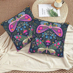 Hidden zipper and soft fabric detail on a folk butterfly velvet pillow cover with navy symmetrical butterflies and flowers