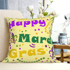 short-pile plush polyester pillow cover with Happy Mardi Gras lettering in purple, green and gold, shown on a cream sofa