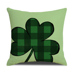 Short-pile plush pillow cover with a large green gingham shamrock, shown on pale green