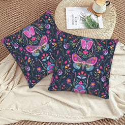 Folk butterfly velvet pillow covers with navy scattered butterflies and flowers, styled on a woven chair