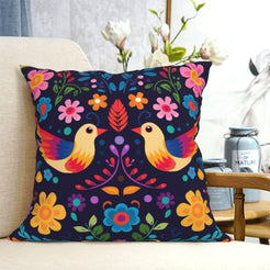 short-pile plush polyester pillow cover with paired colorful birds and flowers on navy, shown on a cream sofa