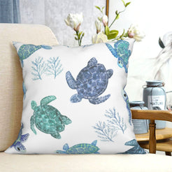 short-pile plush polyester pillow cover with blue and green sea turtles and coral, shown on a cream sofa