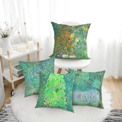 Four green landscape art pillow covers styled on a bench