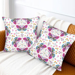 Folk butterfly velvet pillow covers with white circular butterfly motifs, styled on a sofa