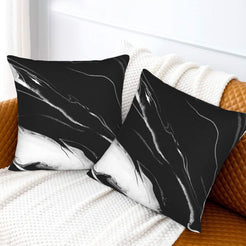 Velvet pillow covers with black and white marble, styled on a cream sofa