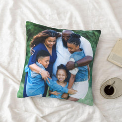 Custom family photo pillow cover styled on a bed