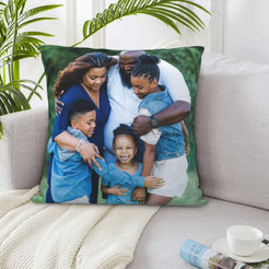 Custom family photo pillow cover styled on a sofa