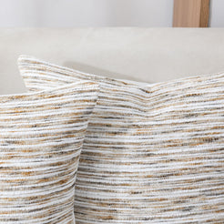 Close-up of the woven texture on chenille-textured polyester pillow cover with cream, gray and ochre horizontal stripes