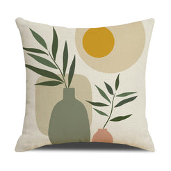Linen-look polyester pillow cover with green vase, branches and mustard sun, shown on white