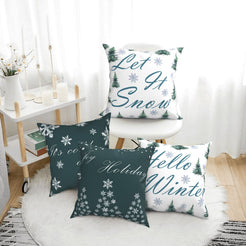 short-pile plush polyester pillow covers with green and white winter quote prints, arranged beside a white chair