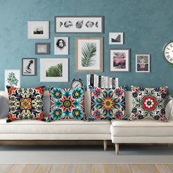 linen-look polyester pillow covers with red, teal and yellow floral medallion prints, styled on a white sectional