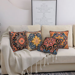 short-pile plush polyester pillow covers with navy, rust and ochre carpet medallion prints, styled on a cream sofa