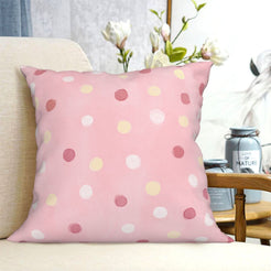 Pink polka dot short-pile plush Easter pillow cover styled on a chair