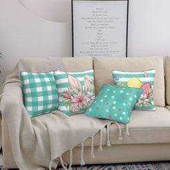 Teal Easter pillow covers with bunnies, plaid, dots and eggs, styled on a sofa